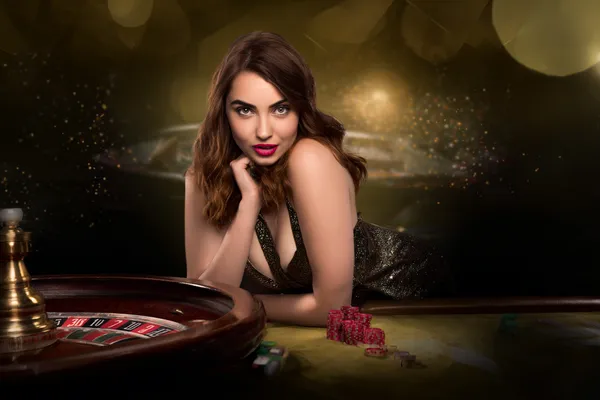 A glamorous woman holding casino chips in a neon-lit environment, representing the premium online casino atmosphere of BINGOMAX.