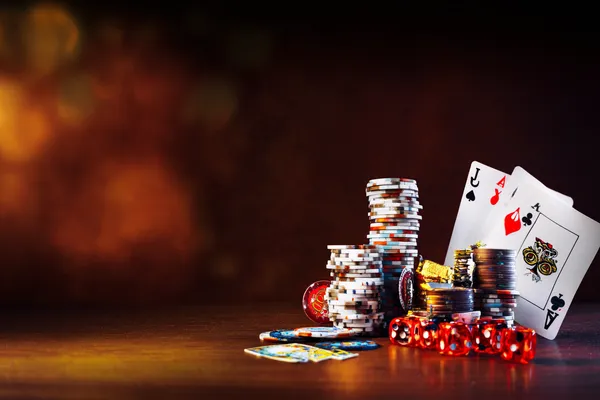 BINGOMAX — A high-class gaming experience without limits A woman in a luxurious green gown next to an ornate roulette wheel, capturing the upscale casino mood of BINGOMAX.