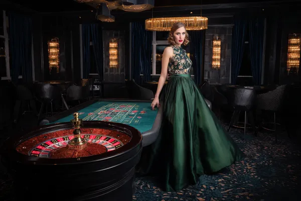 BINGOMAX Mobile Casino — Play anytime, anywhere A player using their smartphone during a festive local event, representing BINGOMAX’s fully mobile-friendly casino.